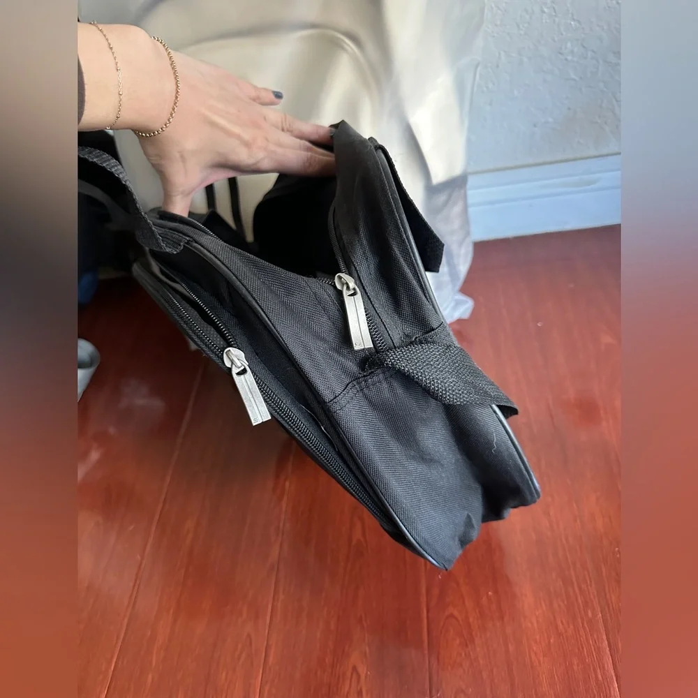 Men’s minimalist black carrying bag for travel or everyday use. Airplane logo.